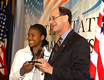 One of the youth winners, rapper Lai Lai, is presented her award by Congressman Brad Sherman