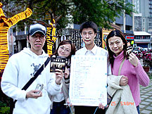 Photo: Teens in Taiwan push home the message of the Human Rights PSAs by passing out booklets and holding a human rights petition drive.