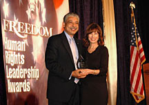 Ms. Anne Archer presents Freedom Magazine's Human Rights Leadership Award to Mr. Bob Goodwin, humanitarian and CEO of the Points of Light Foundation.