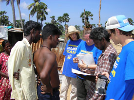 Members of the Human Rights Relief Team meet with local residents and officials